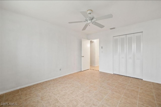 unfurnished bedroom with a closet and ceiling fan