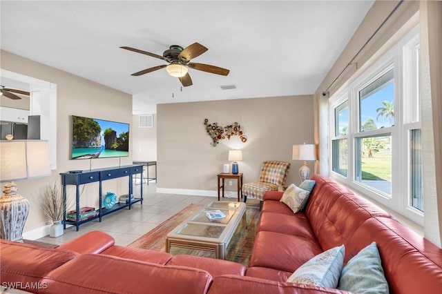 tiled living room featuring ceiling fan