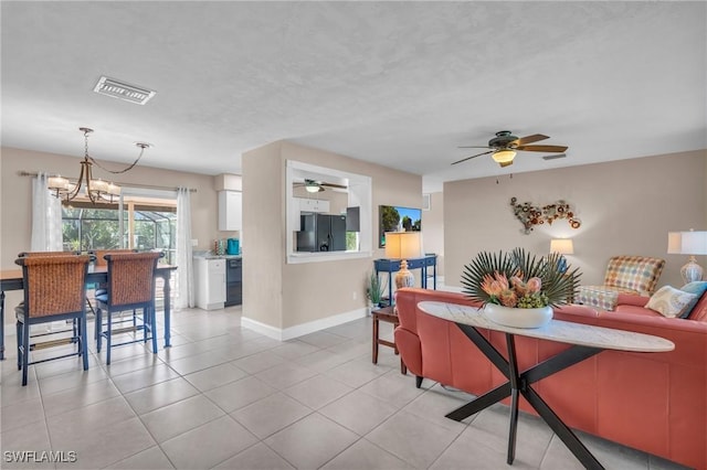 dining room featuring light tile patterned floors and a chandelier