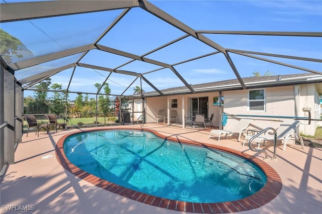 view of pool with a lanai and a patio area