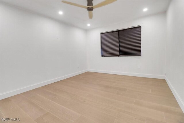 unfurnished room with light wood-type flooring and ceiling fan