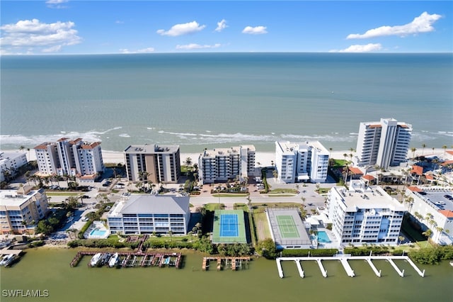 birds eye view of property featuring a water view and a city view