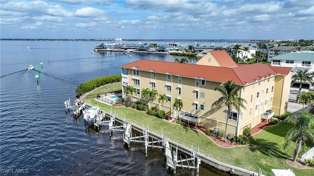 birds eye view of property with a water view