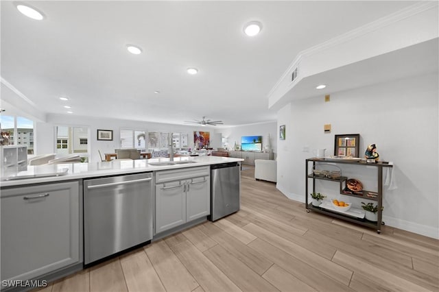 kitchen with gray cabinets, stainless steel dishwasher, ceiling fan, and sink