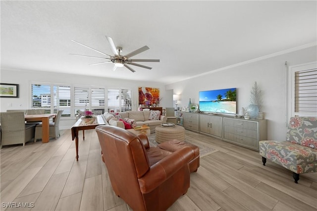 living room with ceiling fan, light wood-type flooring, and crown molding