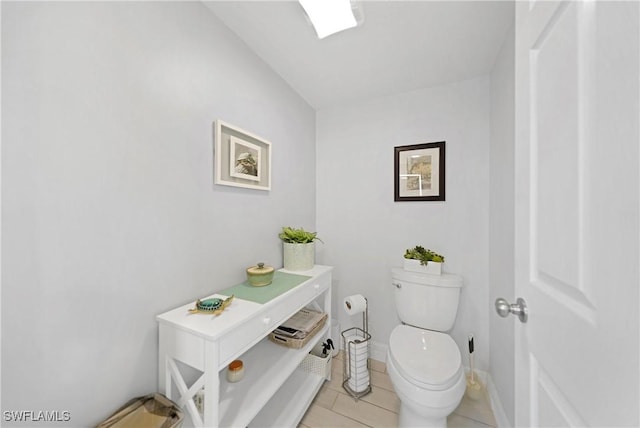 bathroom featuring tile patterned flooring and toilet