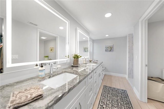 bathroom featuring hardwood / wood-style floors and vanity