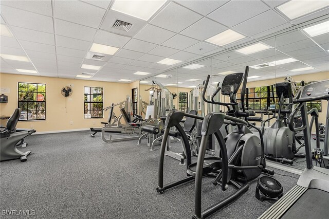 gym featuring a paneled ceiling