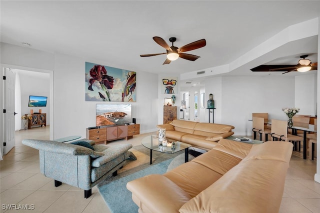 tiled living room featuring ceiling fan