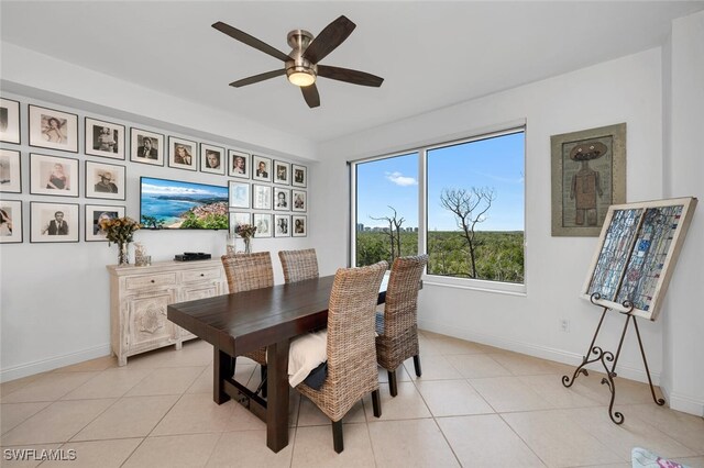 dining area featuring ceiling fan and light tile patterned floors