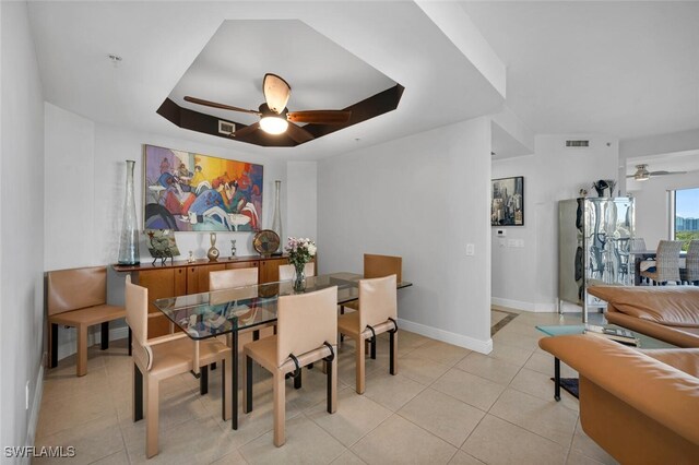 dining area with ceiling fan and light tile patterned floors