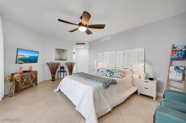 bedroom with ceiling fan and light tile patterned flooring