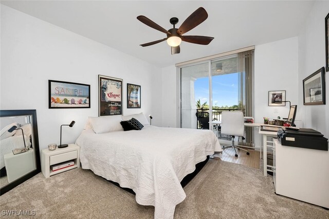 carpeted bedroom featuring access to outside and ceiling fan