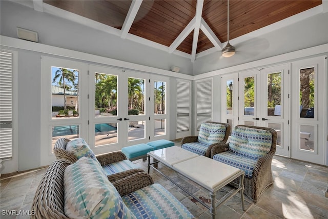 sunroom with ceiling fan, a healthy amount of sunlight, wood ceiling, and french doors