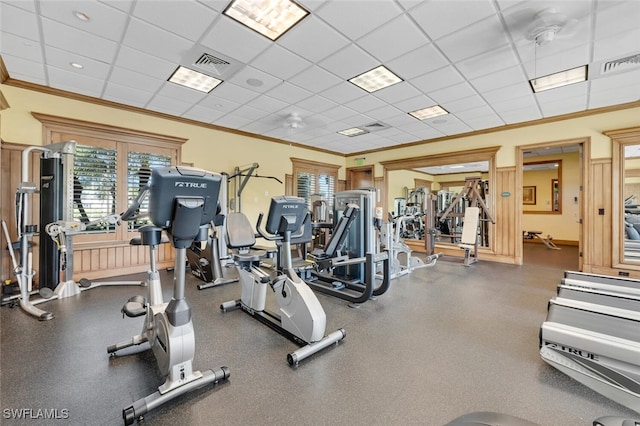 gym with a paneled ceiling