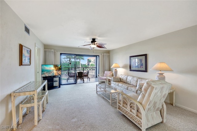 living room featuring ceiling fan and light colored carpet