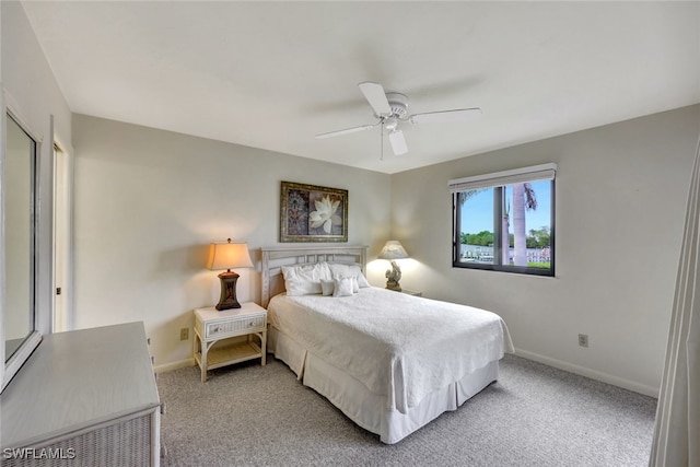 bedroom featuring ceiling fan and carpet