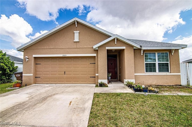 view of front of home featuring a garage and a front lawn