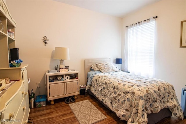 bedroom featuring dark wood-type flooring