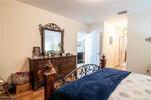 bedroom with light hardwood / wood-style floors