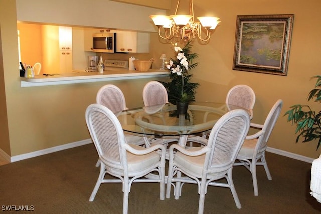 carpeted dining room featuring an inviting chandelier