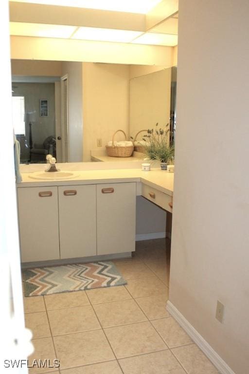 bathroom featuring tile patterned flooring and sink