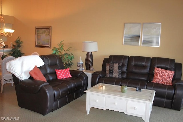 living room featuring a chandelier and light colored carpet