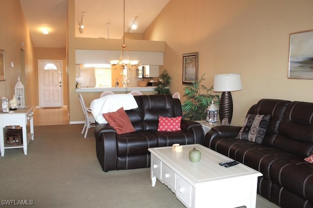 living room with carpet and a notable chandelier