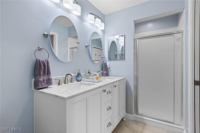 bathroom featuring vanity, tile patterned floors, and an enclosed shower