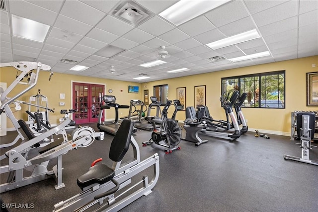 exercise room with a paneled ceiling