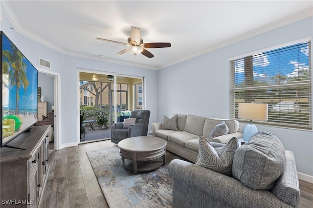 living room featuring ceiling fan, ornamental molding, and hardwood / wood-style flooring