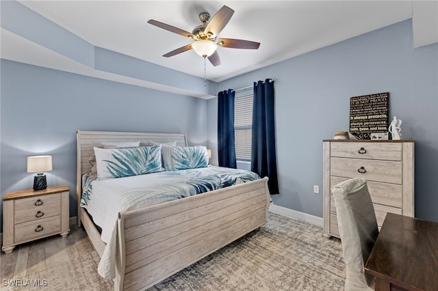 bedroom featuring wood-type flooring and ceiling fan