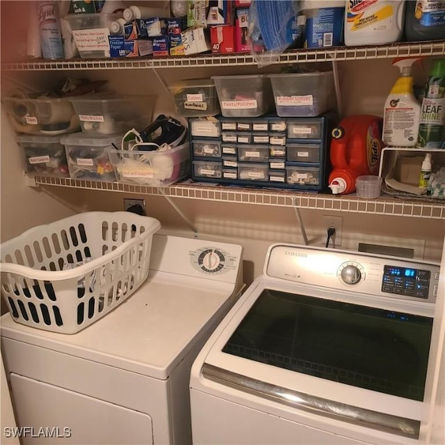 laundry room featuring washer and clothes dryer