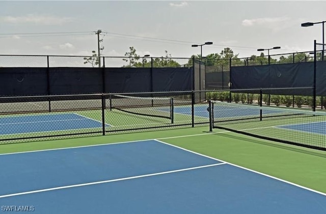 view of sport court featuring basketball hoop