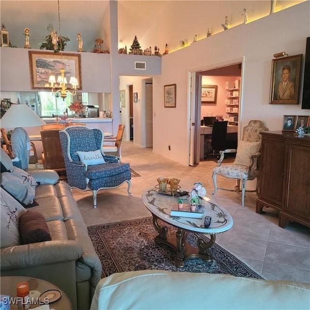 tiled living room featuring a chandelier and a high ceiling