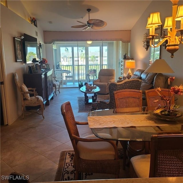 dining space featuring tile patterned floors and ceiling fan