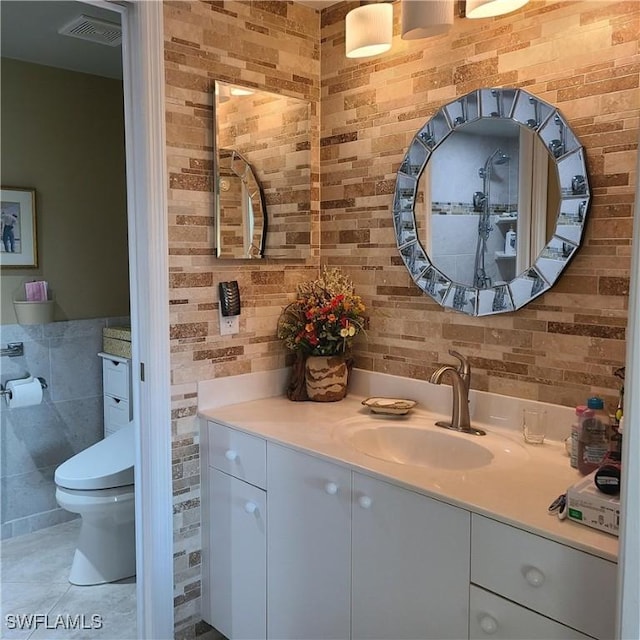 bathroom with tile patterned floors, vanity, and toilet