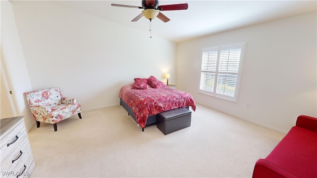 bedroom featuring ceiling fan and light carpet