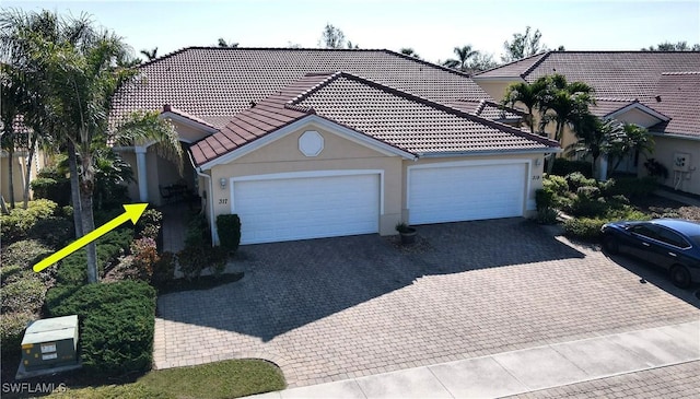 view of front of property featuring a garage