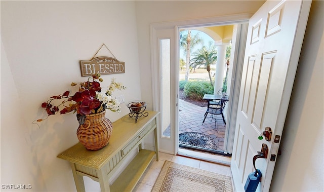 entryway with light tile patterned floors