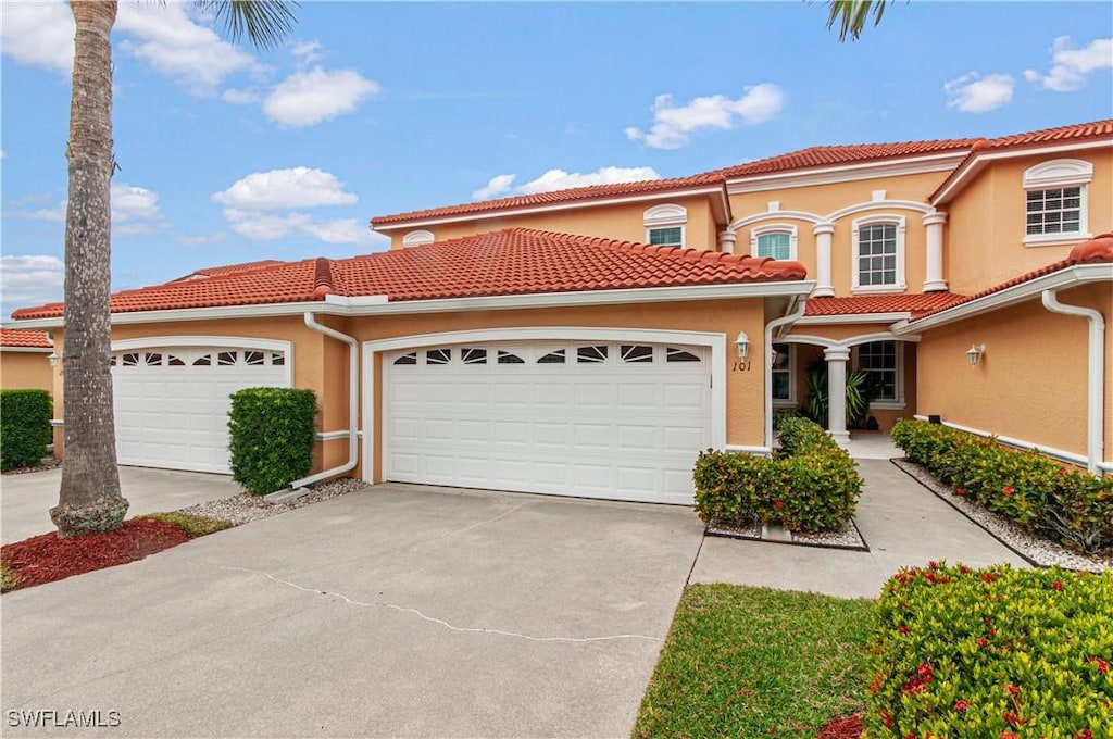 mediterranean / spanish-style house featuring a garage