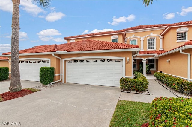 mediterranean / spanish-style house featuring a garage