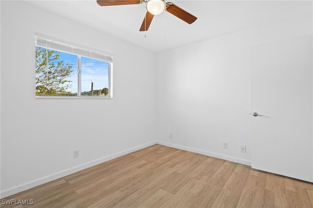 empty room featuring ceiling fan and light hardwood / wood-style flooring