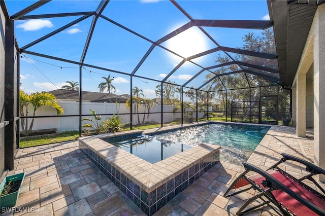 view of swimming pool with a patio and a lanai