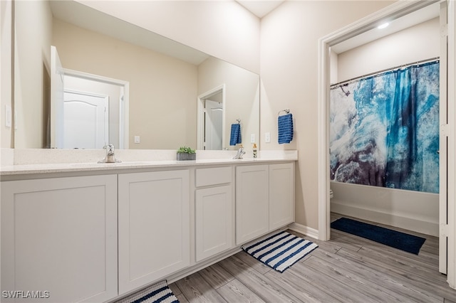 bathroom featuring vanity and hardwood / wood-style floors