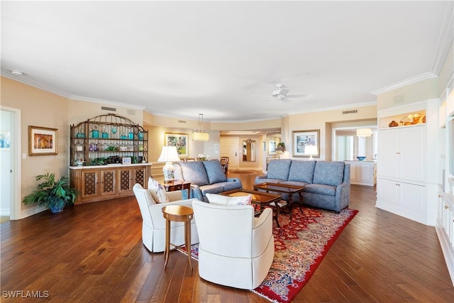 living room featuring ceiling fan, ornamental molding, and dark hardwood / wood-style flooring