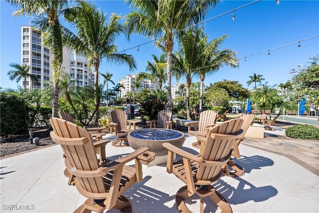 view of patio / terrace featuring an outdoor fire pit