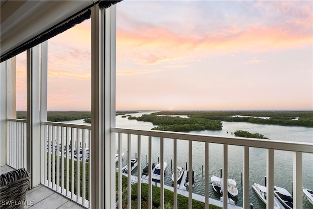 balcony at dusk with a water view