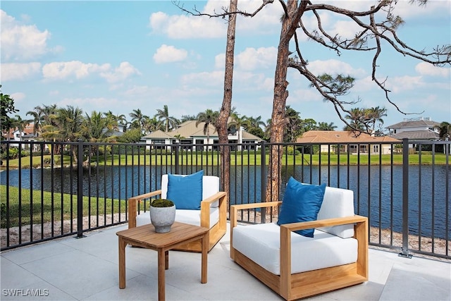 view of patio with a water view and a residential view