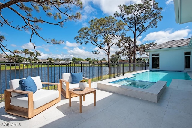 view of swimming pool featuring a patio, an in ground hot tub, a water view, fence, and a fenced in pool